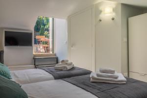 Postel nebo postele na pokoji v ubytování Stella by PortofinoHomes