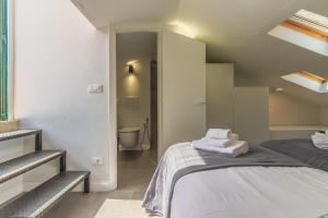 Postel nebo postele na pokoji v ubytování Stella by PortofinoHomes