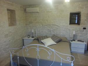 Postel nebo postele na pokoji v ubytování B&B Fiano Marchione
