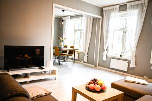 TV a/nebo společenská místnost v ubytování Moderne leilighet ved Solsiden i Trondheim