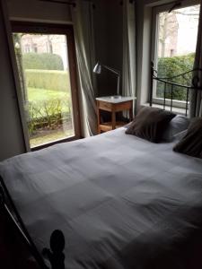 Ein Bett oder Betten in einem Zimmer der Unterkunft B&B De Hulst