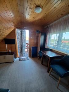Televízia a/alebo spoločenská miestnosť v ubytovaní OW HOLIDAY Wicie