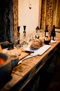 a table with wine glasses and food on it at CASA LUCRECIA in Santiago +34 photos