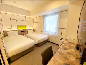 Katil atau katil-katil dalam bilik di Henn na Hotel Osaka Shinsaibashi