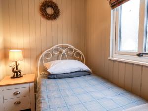 Ένα ή περισσότερα κρεβάτια σε δωμάτιο στο Grouse Lodge