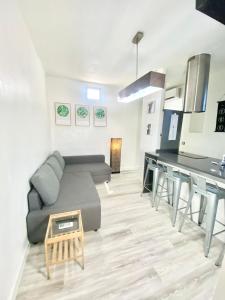 a living room with a couch and a table at Piramides 1 Apartment in Madrid