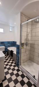 a bathroom with a shower and a sink and a tub at The Tuck Away, Central Old Town with Parking in Hastings