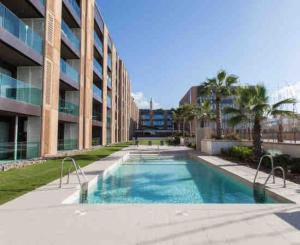 una grande piscina di fronte a un edificio di Ain diab- luxury appart hotel LRM ,free parking a Casablanca