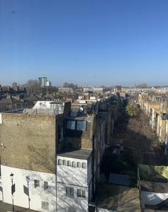 an aerial view of a city with buildings at 2 Bedroom Chelsea Apartment in London