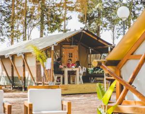 a group of people sitting at a table in a yurt at TAIGA Conil in Conil de la Frontera +60 photos