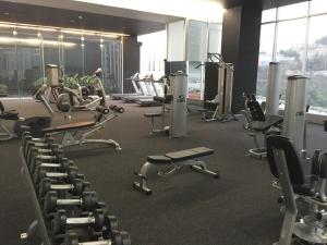 a gym with rows of exercise equipment in a building at Distrito in Mexico City