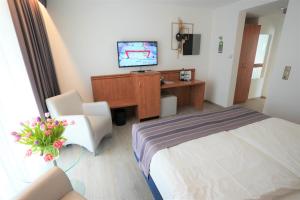 Postel nebo postele na pokoji v ubytování Parkhotel Sonnenberg