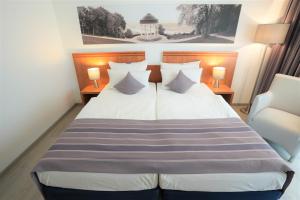 Postel nebo postele na pokoji v ubytování Parkhotel Sonnenberg