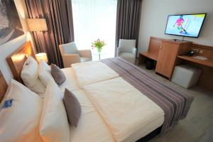 TV a/nebo společenská místnost v ubytování Parkhotel Sonnenberg