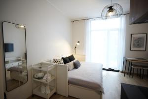 Postel nebo postele na pokoji v ubytování Riia Kvartal Apartment