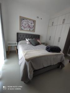 a bedroom with a large bed in a room at Condominio Palomino en Viñedos del Mar Ensenada privada San Antonio in Ensenada