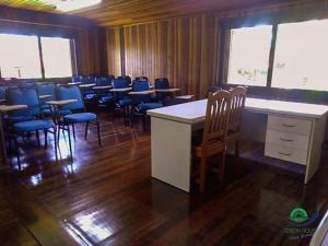 a room with tables and chairs in a room with wood at Morada Das Araucárias in São Francisco de Paula +204 photos