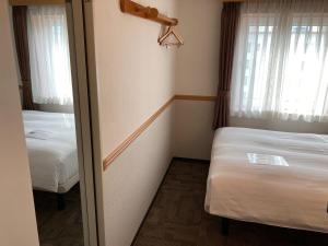 Postel nebo postele na pokoji v ubytování Toyoko Inn Busan Seomyeon