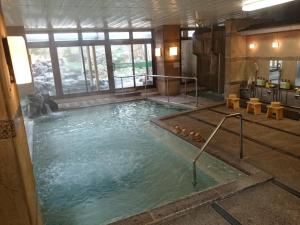a large pool of water in a building at Kasuga Hotel in Nara