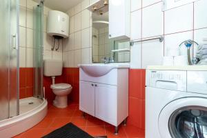 a bathroom with a washing machine and a sink at Villa Tiha luka in Neum +223 photos