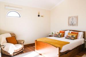 מיטה או מיטות בחדר ב-Namastê House I