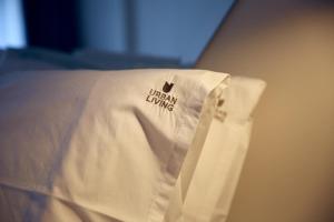 A bed or beds in a room at Urban Living 4