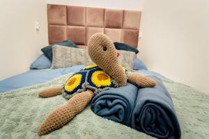 Posteľ alebo postele v izbe v ubytovaní Apartamenty centrum