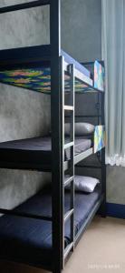 a group of bunk beds with pillows on them at Lapa Casa Hostel in Rio de Janeiro