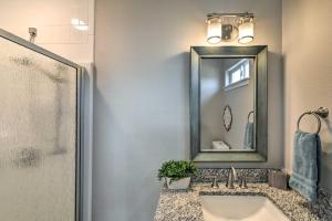 a bathroom with a sink and a mirror at Surfside Beach Vacation Rental with Ocean Views in Freeport +27 photos