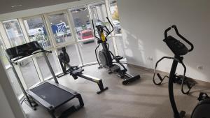 a gym with several exercise bikes in a room at First Inn Hotel Paris Sud Les Ulis in Les Ulis