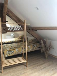 Posteľ alebo postele v izbe v ubytovaní Gîte les voisins de la campagne