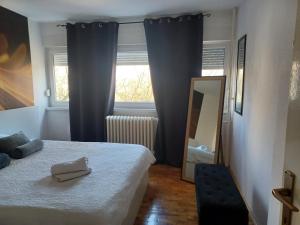 Postel nebo postele na pokoji v ubytování Apartment M&A