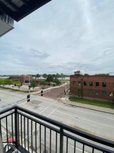 a view of an empty street from a balcony at River Front Luxury Furnished Studio Downtown QC in Davenport