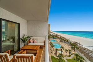 a balcony with a view of the beach at The Summit 803 - Luxury Beach Resort Condo - Beachfront - Incredible Views - BEACH CHAIRS AND SUNSHADE Provided In Condo in Panama City Beach
