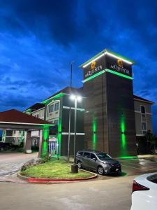 a building with a car parked in front of it at La Quinta by Wyndham Alvarado in Alvarado