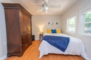 a bedroom with a large bed and a ceiling fan at Close to Beach, Hot Tub, Pet Friendly, Firepit in Michigan City