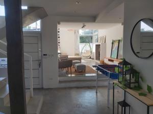 a room with a living room with a mirror at Casa La Marejada in Mar Azul