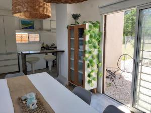 a kitchen and dining room with a table and a window at Casa La Marejada in Mar Azul