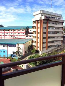 a view of a building from a balcony at Megatower Residences 3(8F-34) in Baguio