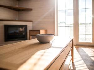 a bowl sitting on a table in a living room at Aspen Lodge in Willington