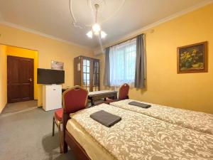 Televízia a/alebo spoločenská miestnosť v ubytovaní Luxi Romantik Apartments + 15 fotografií
