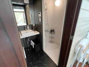 a bathroom with a shower and a sink at THE Retreat in Iizuka +49 photos