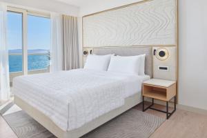 Postel nebo postele na pokoji v ubytování Le Meridien Lav Split