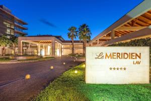 a building with a sign that reads meridian law at Le Meridien Lav Split in Podstrana