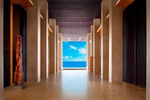 an empty hallway with a view of the ocean at JW Marriott Los Cabos Beach Resort & Spa in San José del Cabo