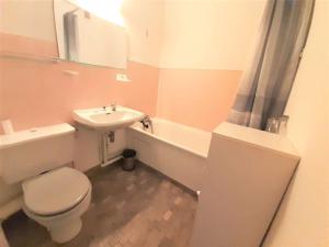 a bathroom with a white toilet and a sink at Studio Saint-Lary-Soulan, 1 pièce, 4 personnes - FR-1-457-250 in Saint-Lary-Soulan