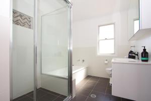 a bathroom with a shower and a toilet at Stay in Mudgee in Mudgee