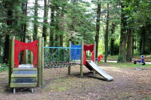 a group of playground equipment in a park at Ballyhoura Mountain Lodges in Ballyorgan