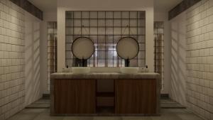 ein Badezimmer mit zwei Waschbecken und zwei Spiegeln in der Unterkunft Green Hill Boutique Hotel in Labuan Bajo