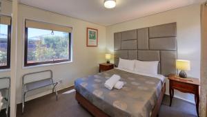 Postel nebo postele na pokoji v ubytování Executive Hideaway